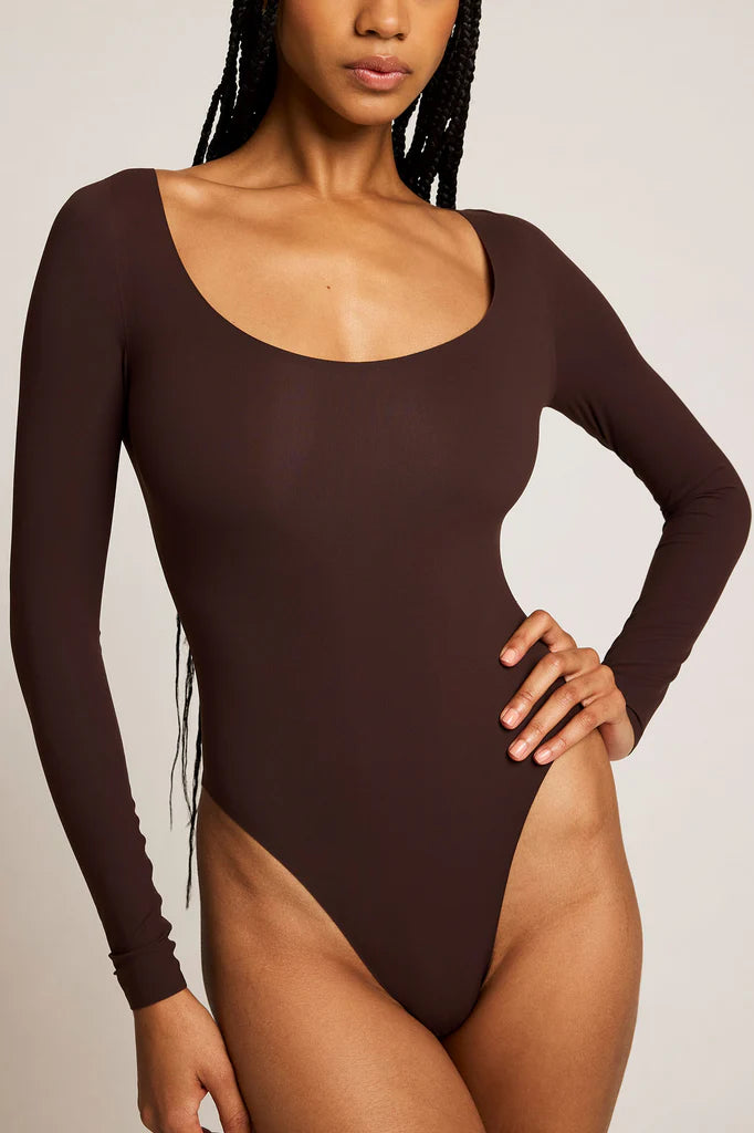 Sovereign woman in black Base Ballet Bodysuit - foundational layer of power - second skin authority - Lux & Motion