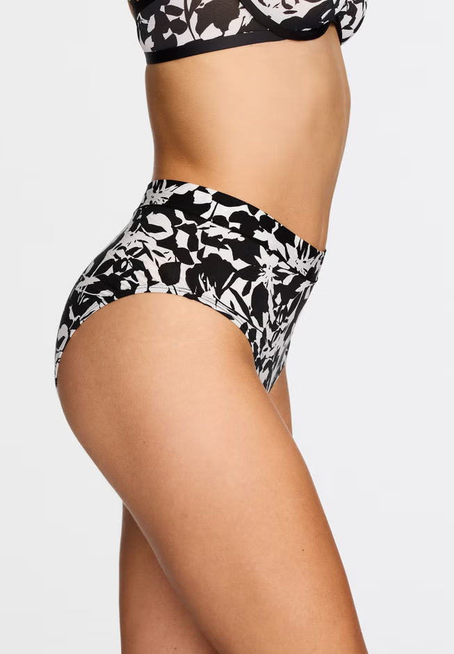 Black and white floral high-waisted bikini bottom on a plain background
