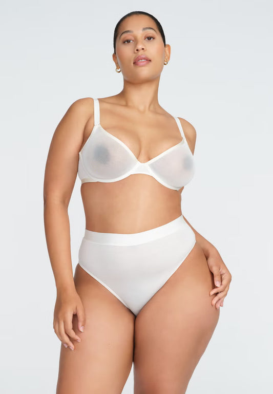 High‑rise modal brief in neutral tone; high‑cut leg, antimicrobial bamboo gusset, no‑dent high‑stretch waistband, butter‑soft texture.