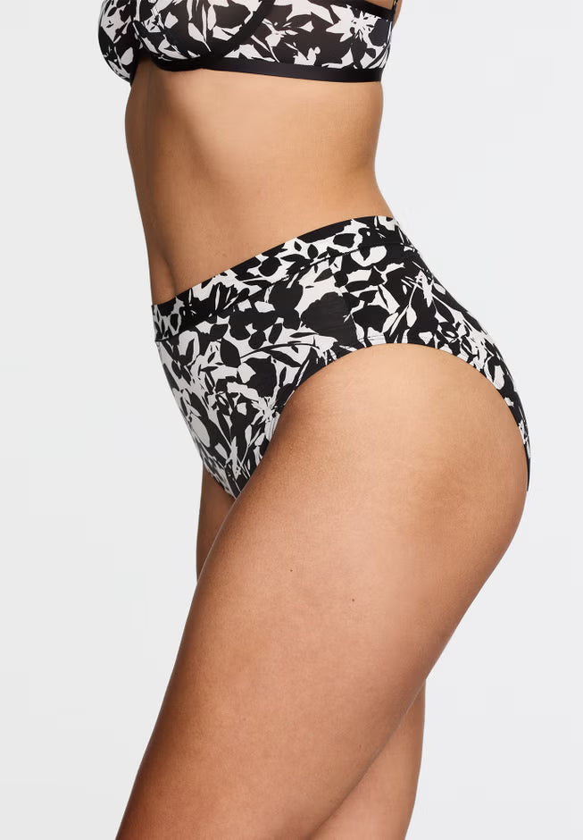 Black and white floral bikini set on a neutral background