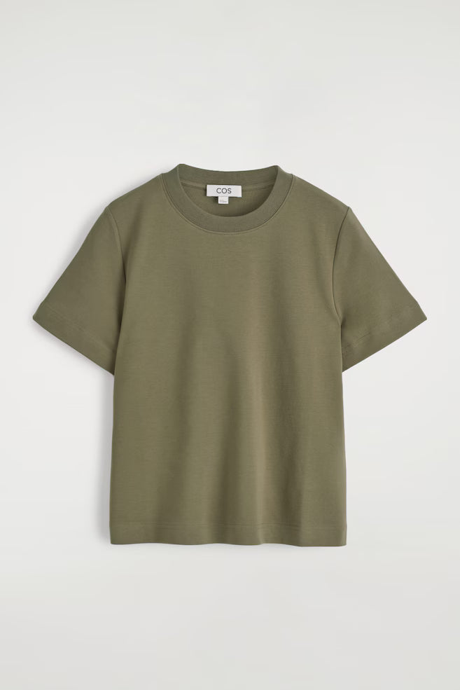 Green t-shirt on a light gray background