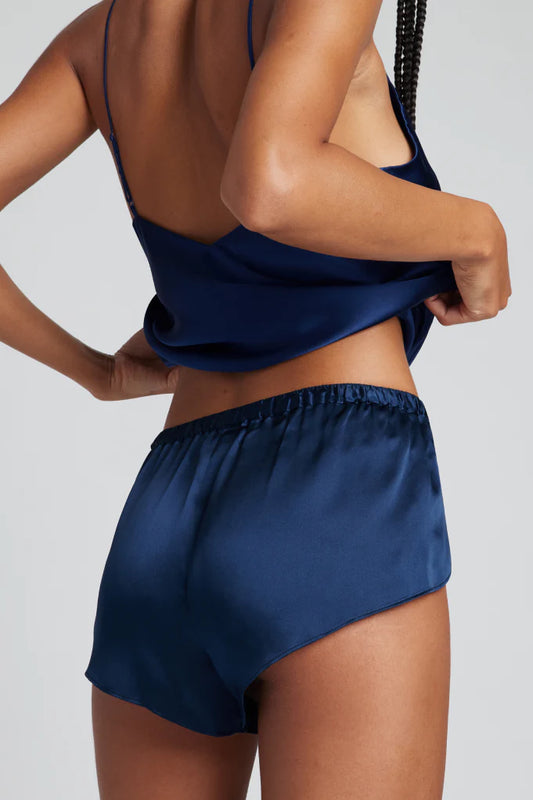 Sovereign woman in Eclipse Silk Mini Short navy blue - menswear-inspired luxury - washable silk authority - Lux & Motion