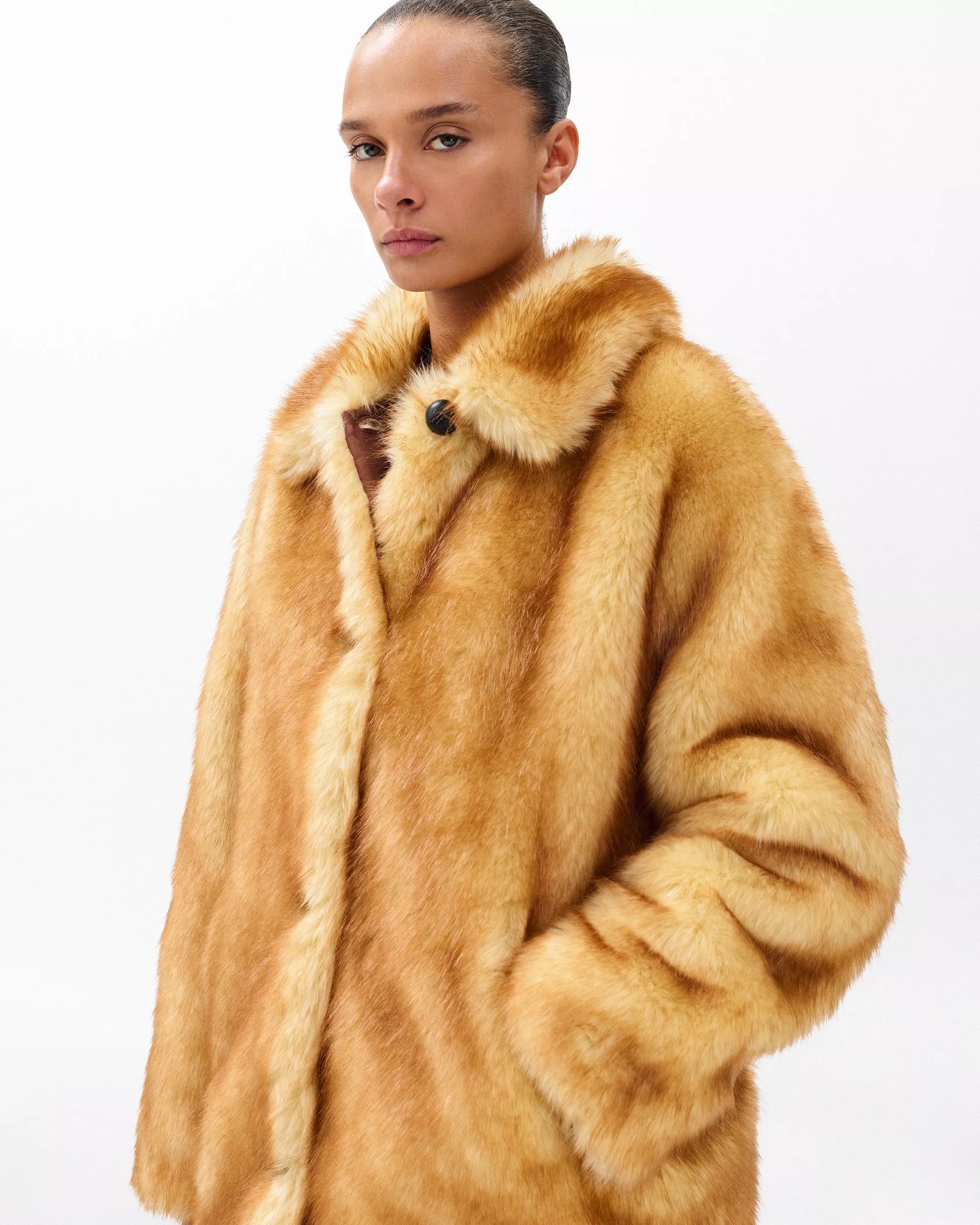 Woman wearing Brenna Faux Fur Jacket by Lux & Motion | Oversized faux fur jacket for bold statements | Luxury ethical fashion | Foundation 2025 Collection