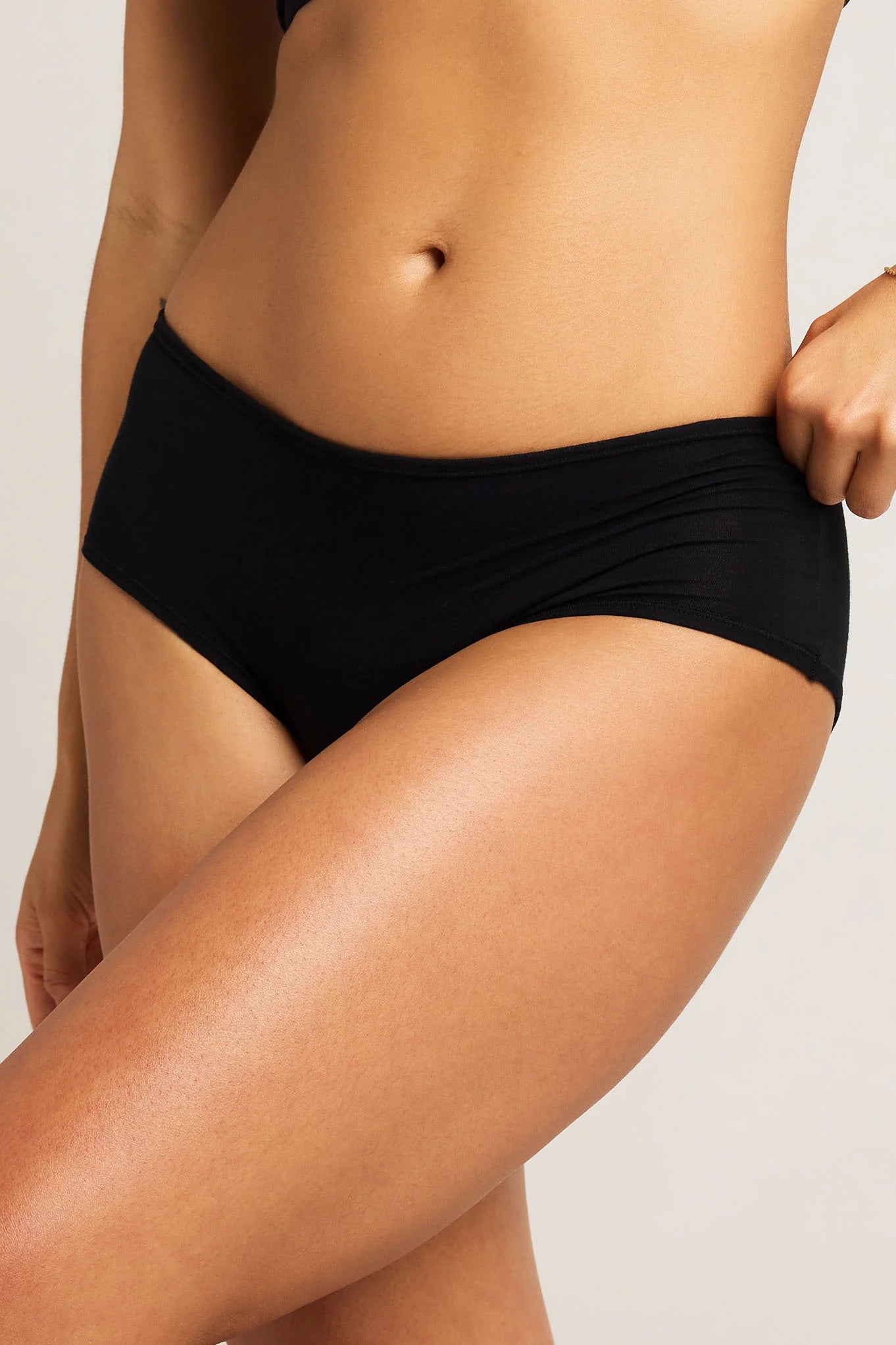 Cloud Cotton Boy Short 3-Pack in black — high-rise cotton boy shorts with 100% cotton gusset, worn by executive woman in luxury lounge setting, Lux & Motion Provocateur Collection