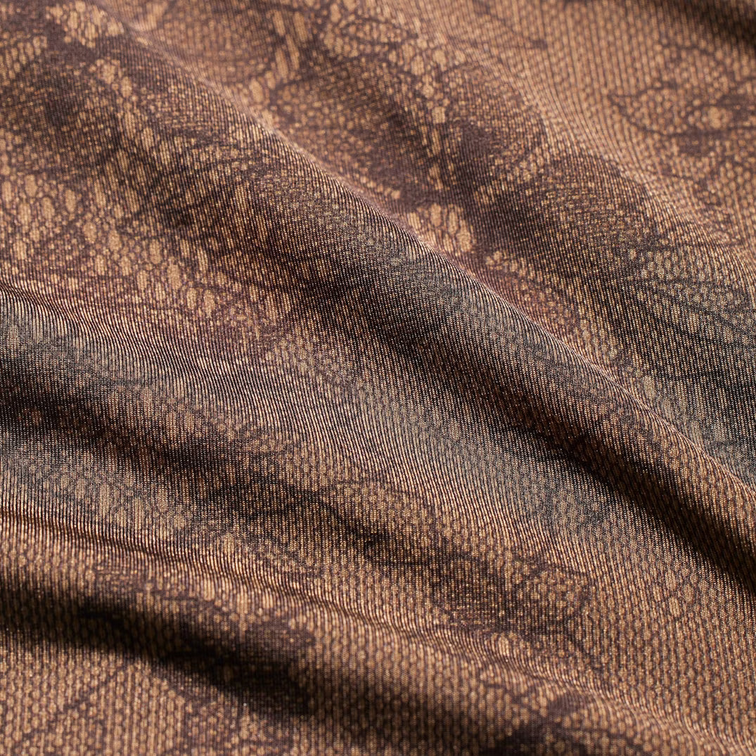 Close-up of brown fabric with a subtle pattern