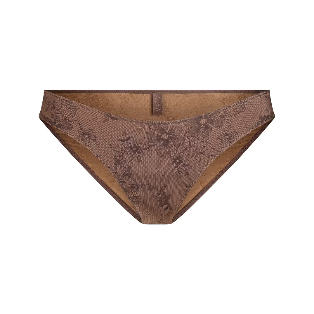 Brown lace underwear on a white background