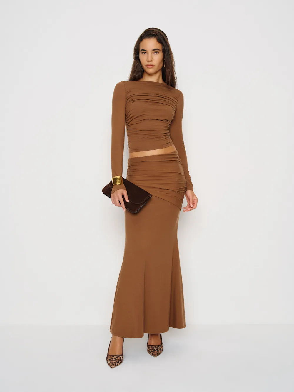 Emi Knit Two Piece in TENCEL™ stretch knit — fitted bodice with column skirt and boat neckline, soft handfeel, worn by global executives as sovereign uniform, Lux & Motion Editor’s Vault
