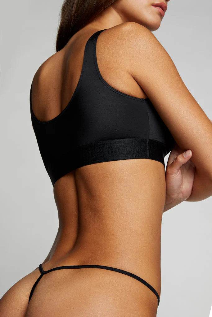 Black bikini set on a neutral background