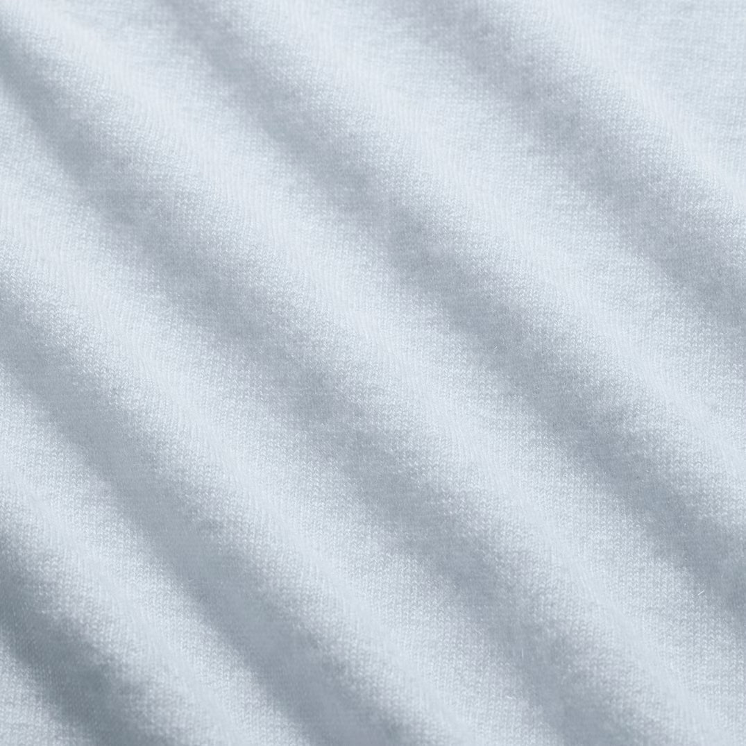 Close-up of light gray fabric with subtle texture