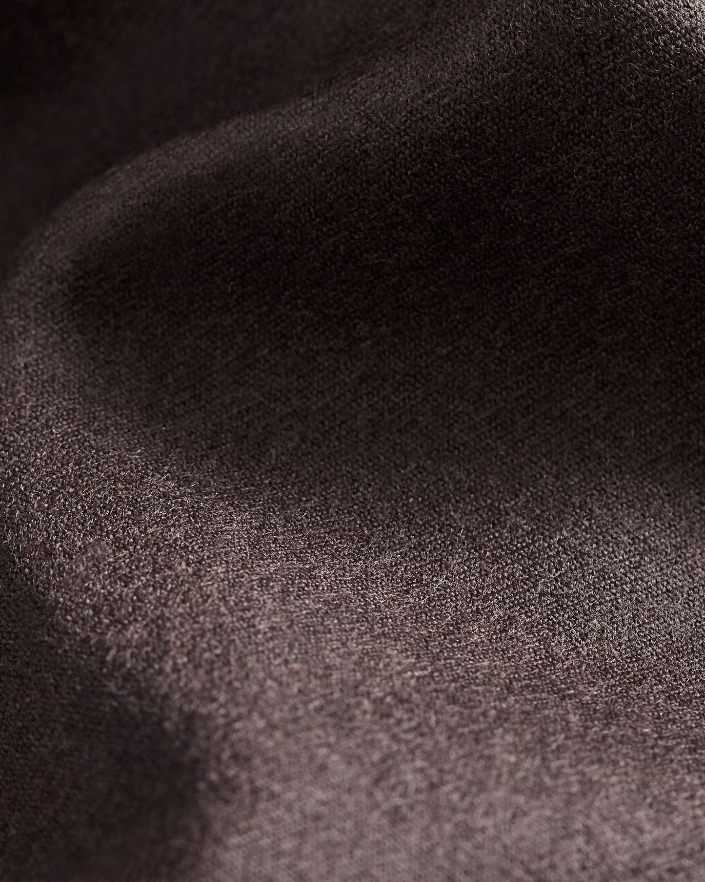 Close-up of dark brown fabric texture