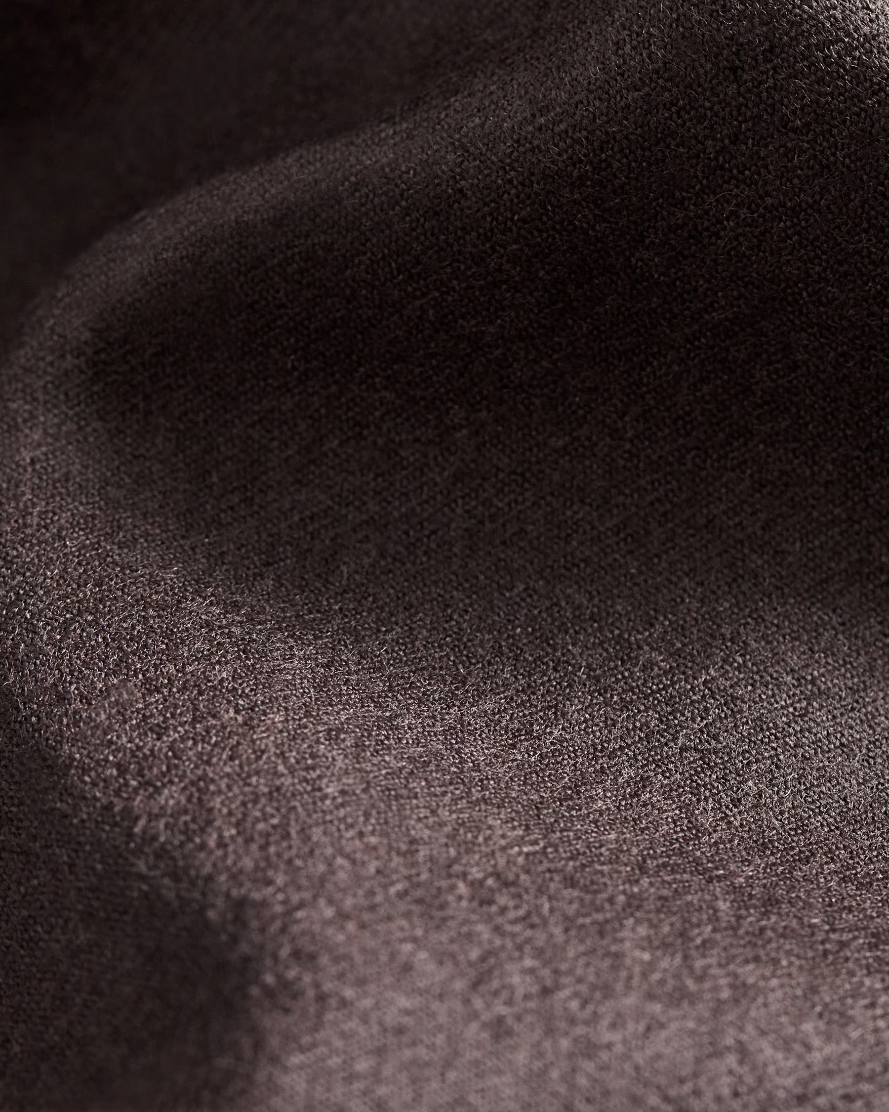 Close-up of dark brown fabric texture