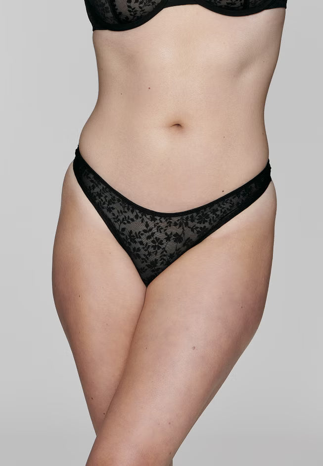 Five‑pack mid‑rise botanical lace thongs in assorted colors; minimal back coverage, bamboo antimicrobial gusset, lightweight stretch lace.