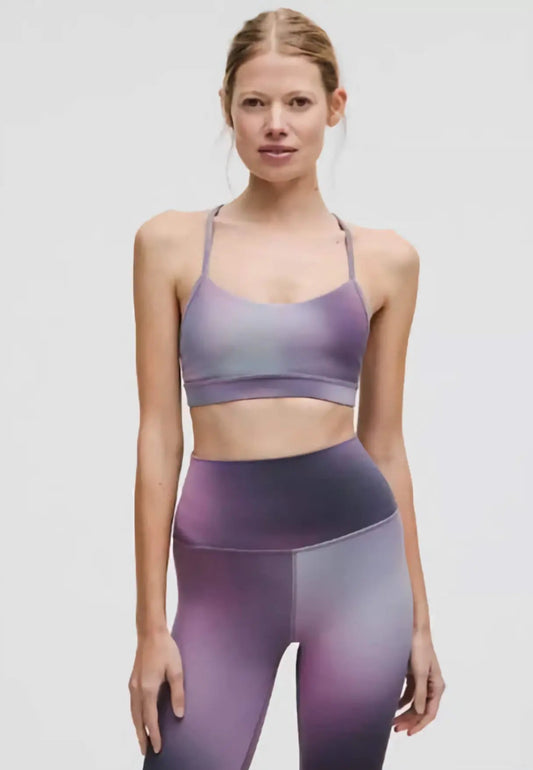 Woman in a yoga pose wearing the Align High-Rise Crop 17" in black, showcasing the second-skin fit and Nulu™ fabric's buttery softness