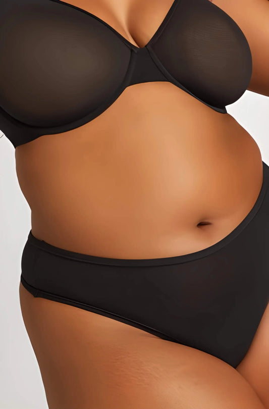 Flat lay of the Cloud Cotton Thong 3-Pack in classic black, showcasing its minimalist design and high-cut silhouette for invisible comfort.