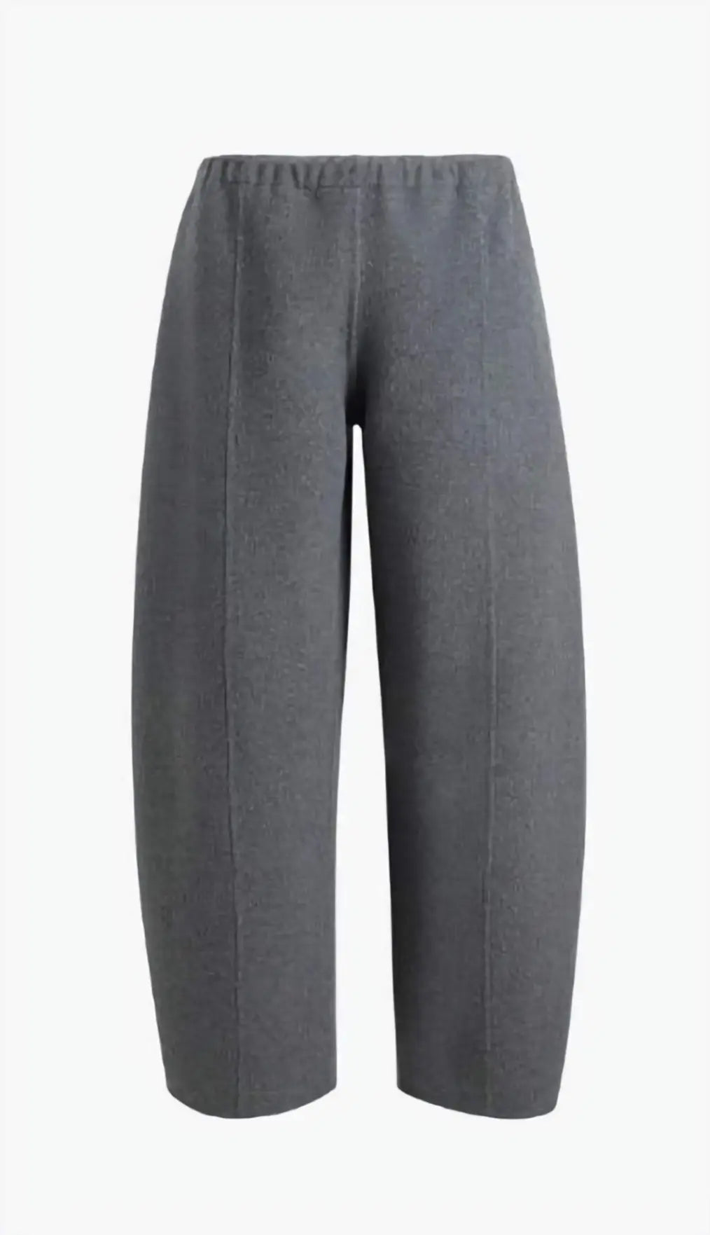 The Clover Pant in camel double-faced wool, showcasing the cropped silhouette and clean lines on a model, emphasizing its structured elegance.