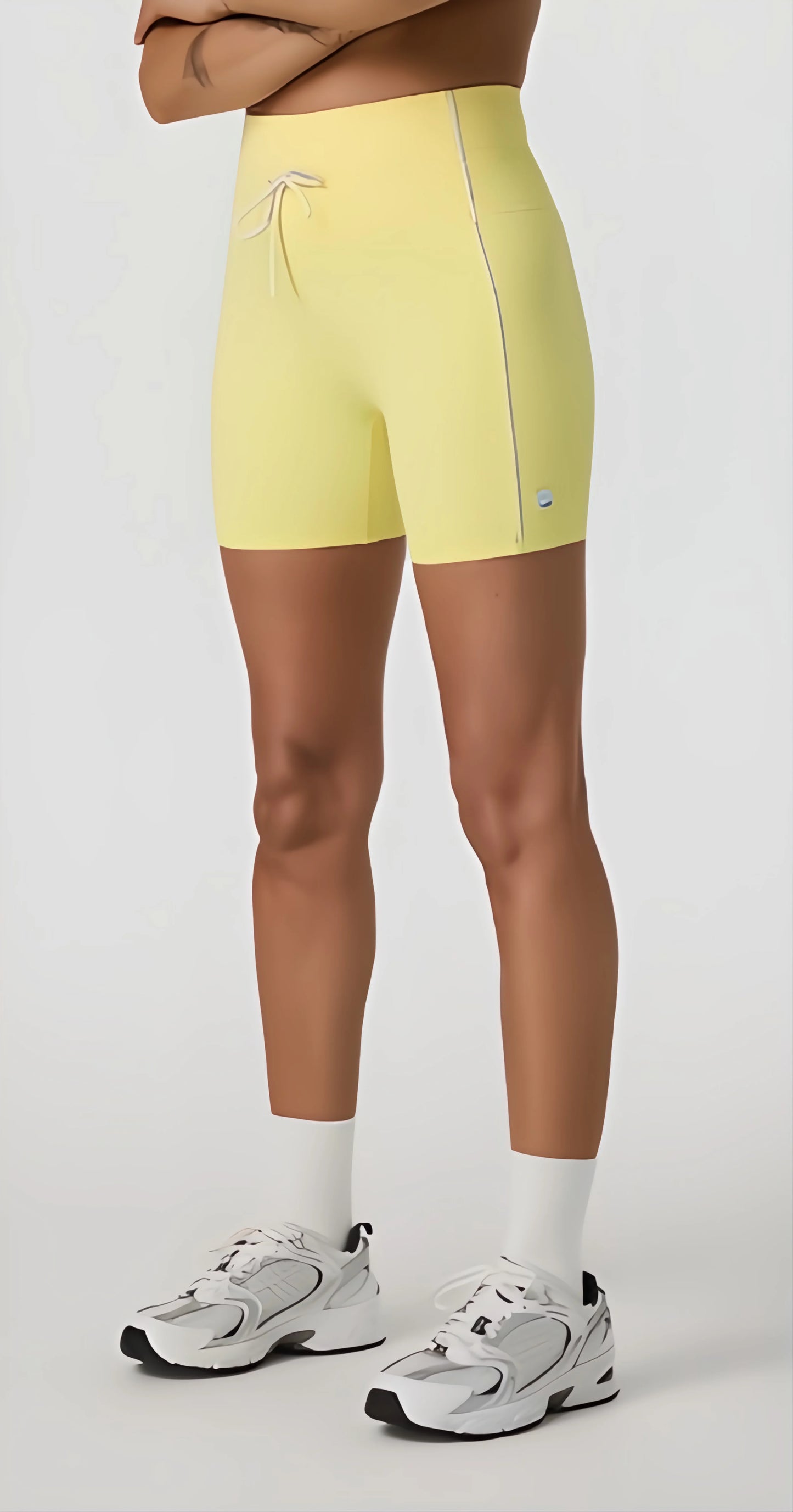 Daily Piped Short 5" in viridian green, showcasing the high-rise waistband and piped detailing on a model in a dynamic pose.