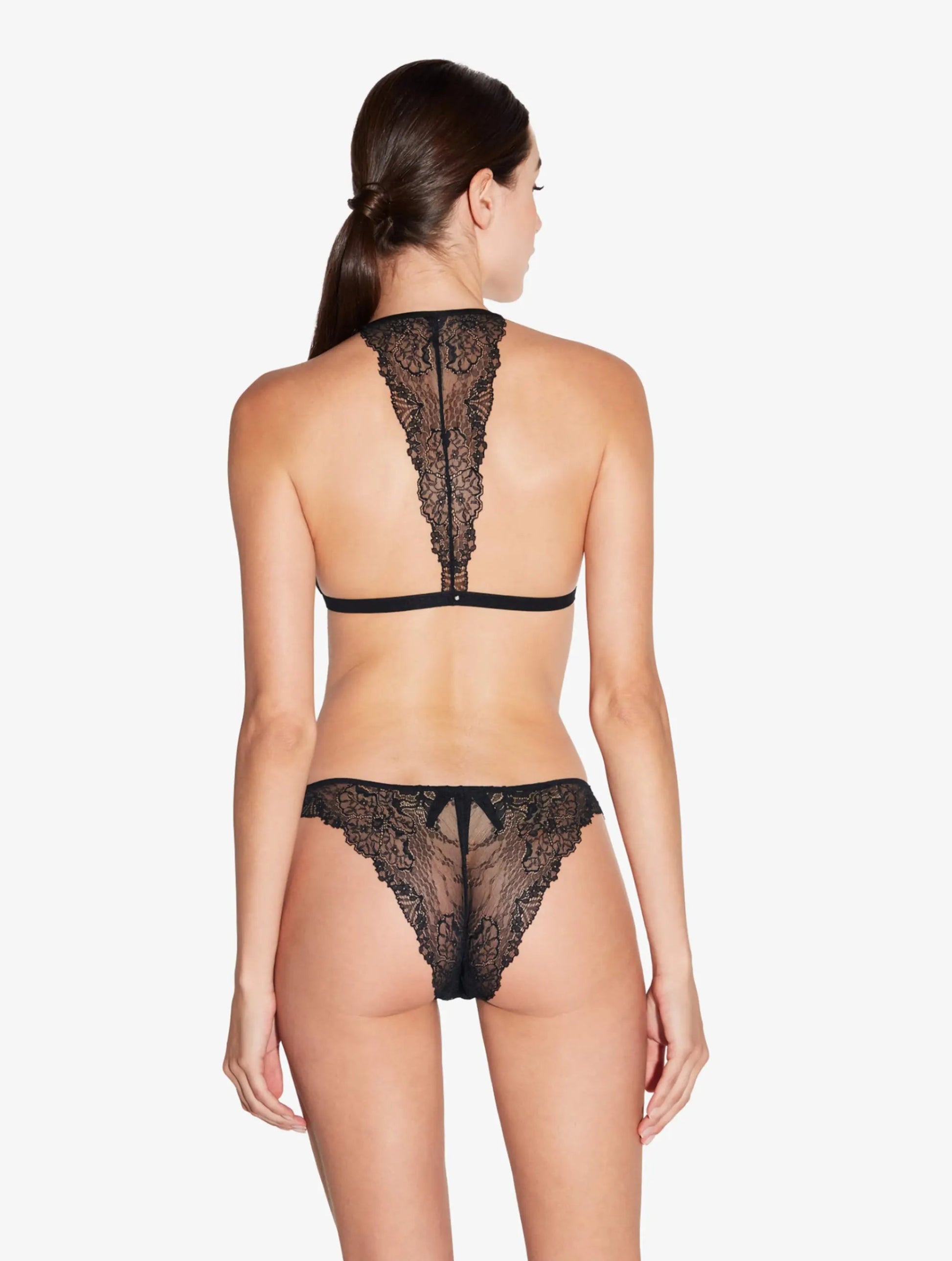 Black lace lingerie set on a white background