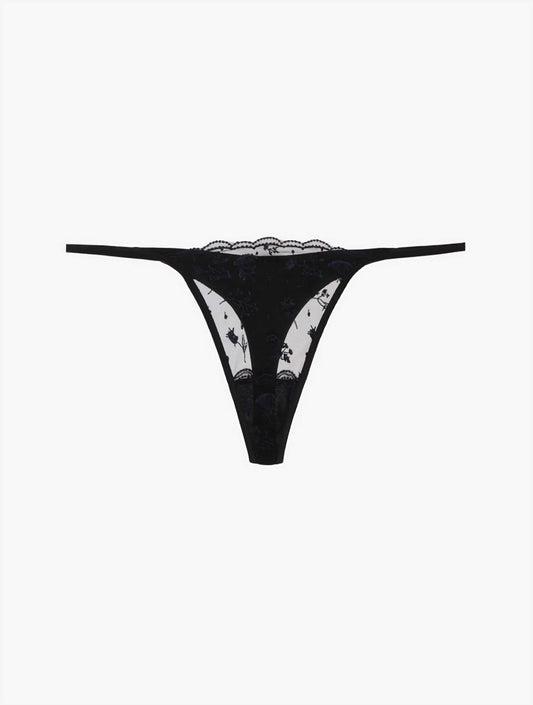 The Midnight Botanica Thong in onyx black, showcasing the delicate floral embroidery on sheer tulle and its minimalist silhouette.