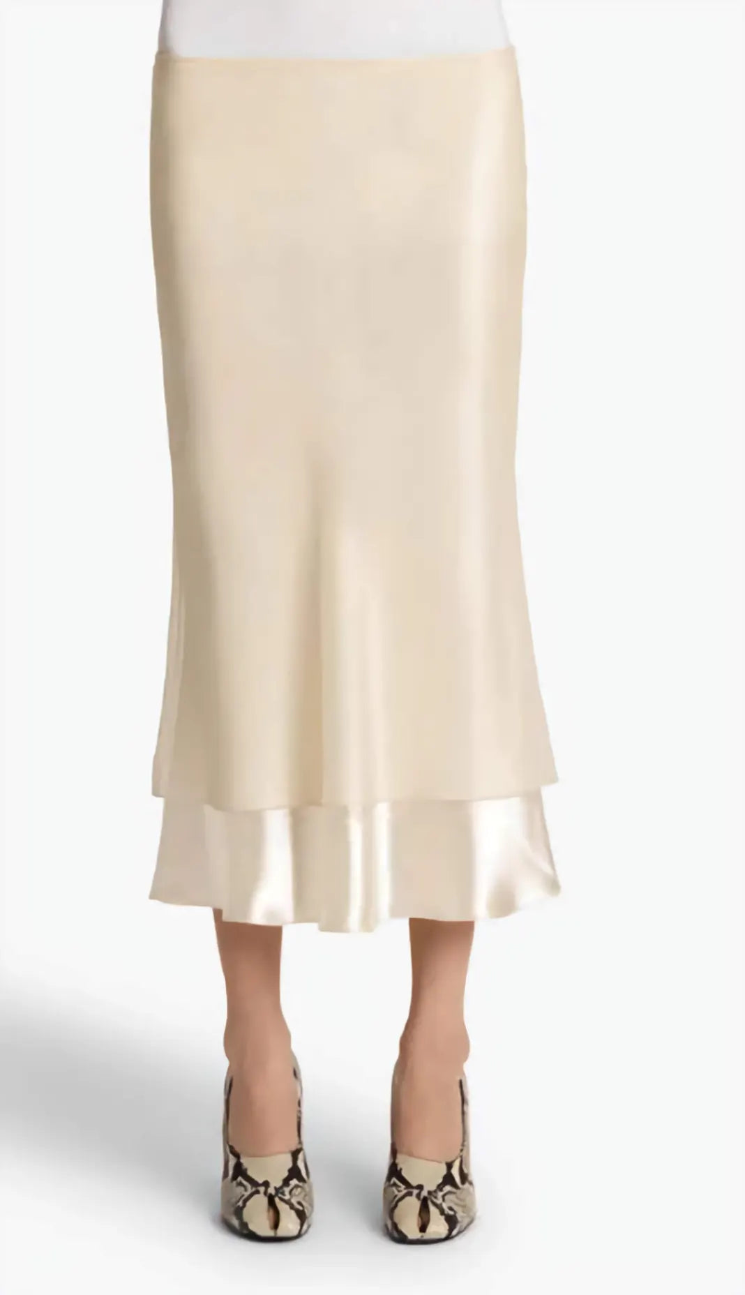 Beige skirt worn by a person on a white background