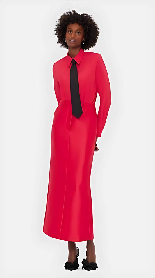 The Eve Maxi Skirt in soft Rosa, showcasing the high-rise waist and fluid drape on a model, highlighting its elongated silhouette.