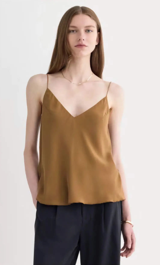 The Tie Back Cami in black clean silk, showcasing the adjustable tie-back and fluid drape on a model, emphasizing its sustainable elegance