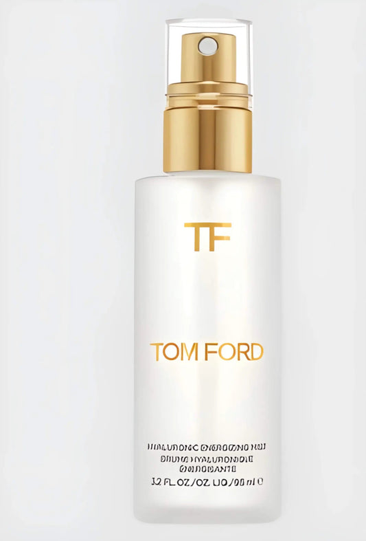 The Tom Ford Hyaluronic Energizing Mist bottle, elegant and minimalist, on a sleek surface, embodying precision luxury for on-the-go radiance