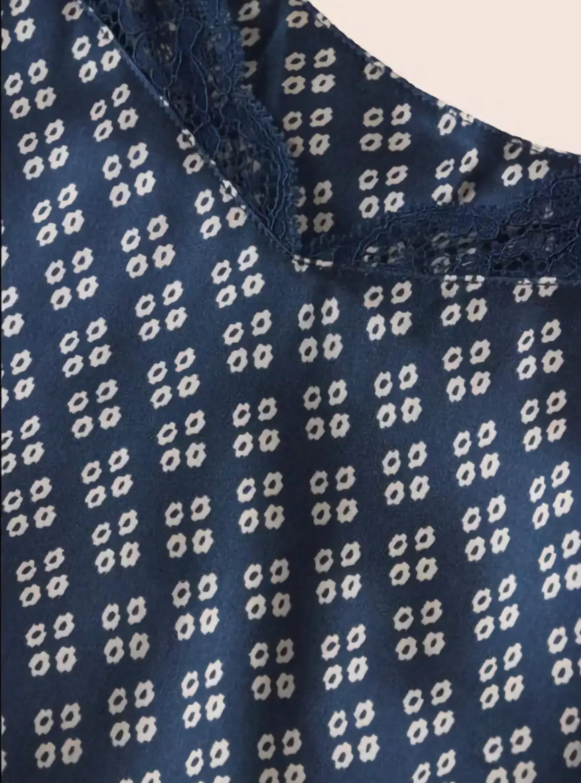 Close-up of a blue fabric with white geometric pattern