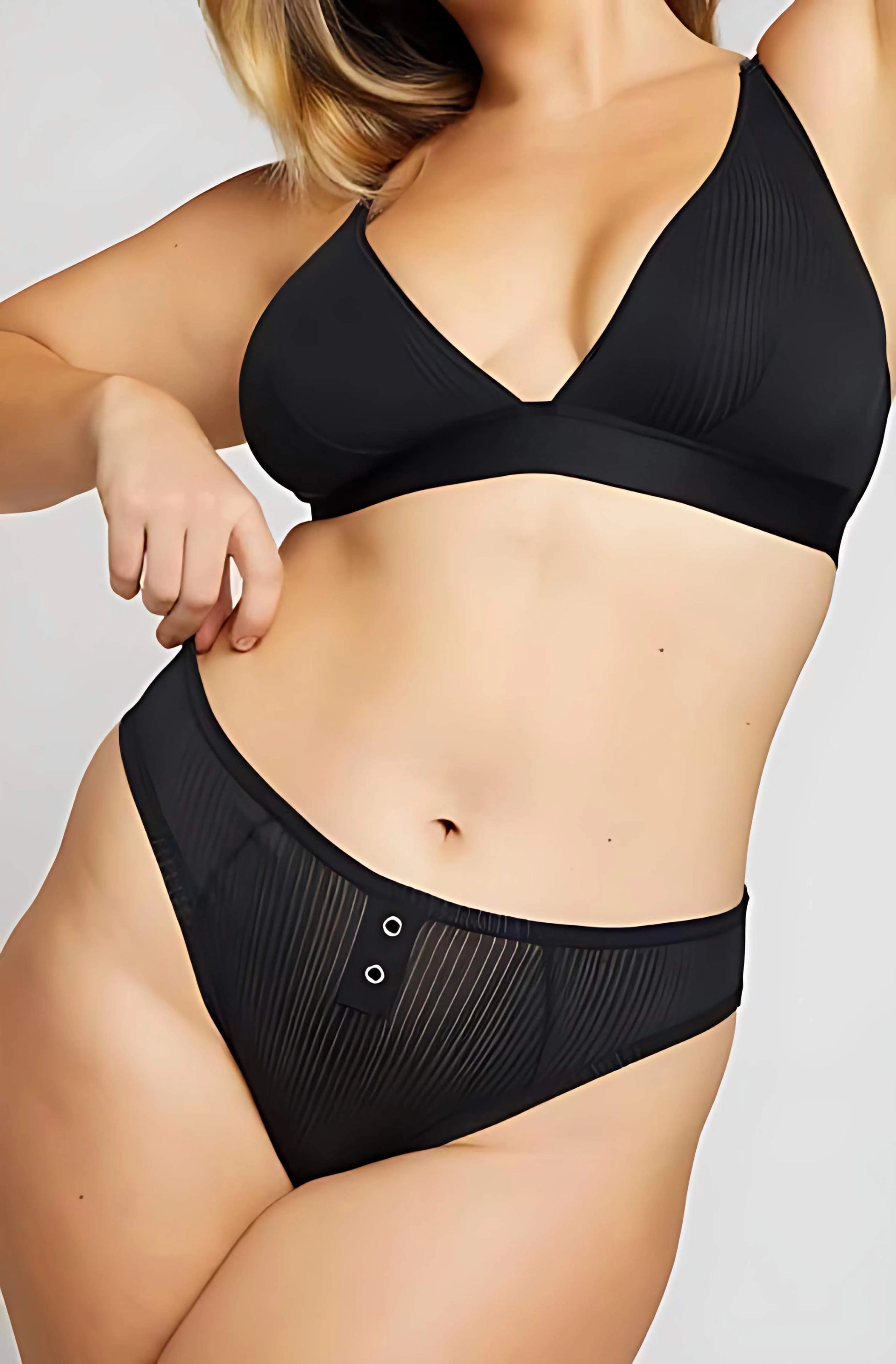 Black lingerie set on a plain background